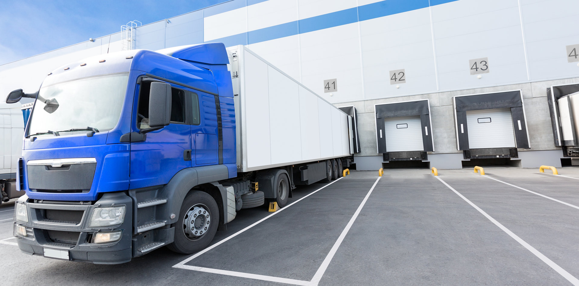Blue Truck and Gates of Big distribution warehouse
